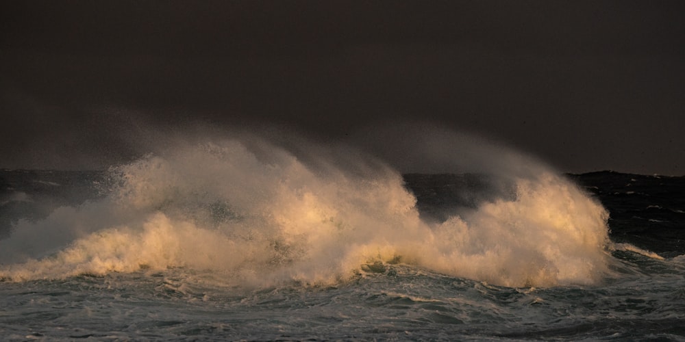 ocean waves crashing on shore during daytime