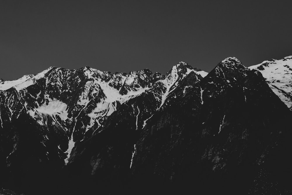 grayscale photo of snow covered mountain