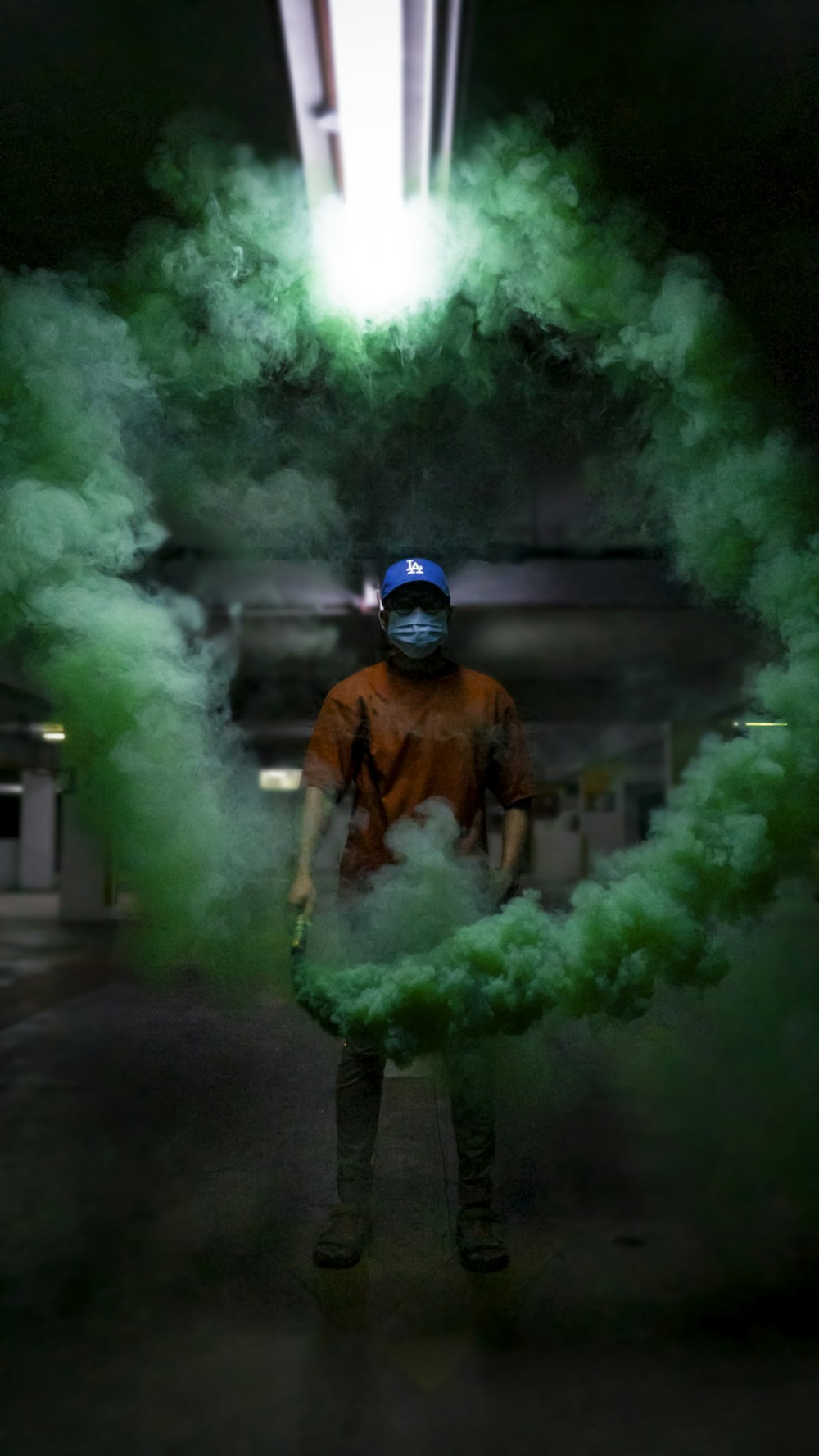 man in brown jacket and black pants holding green smoke