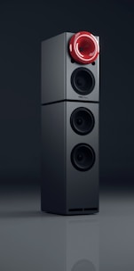black and gray speaker on black surface