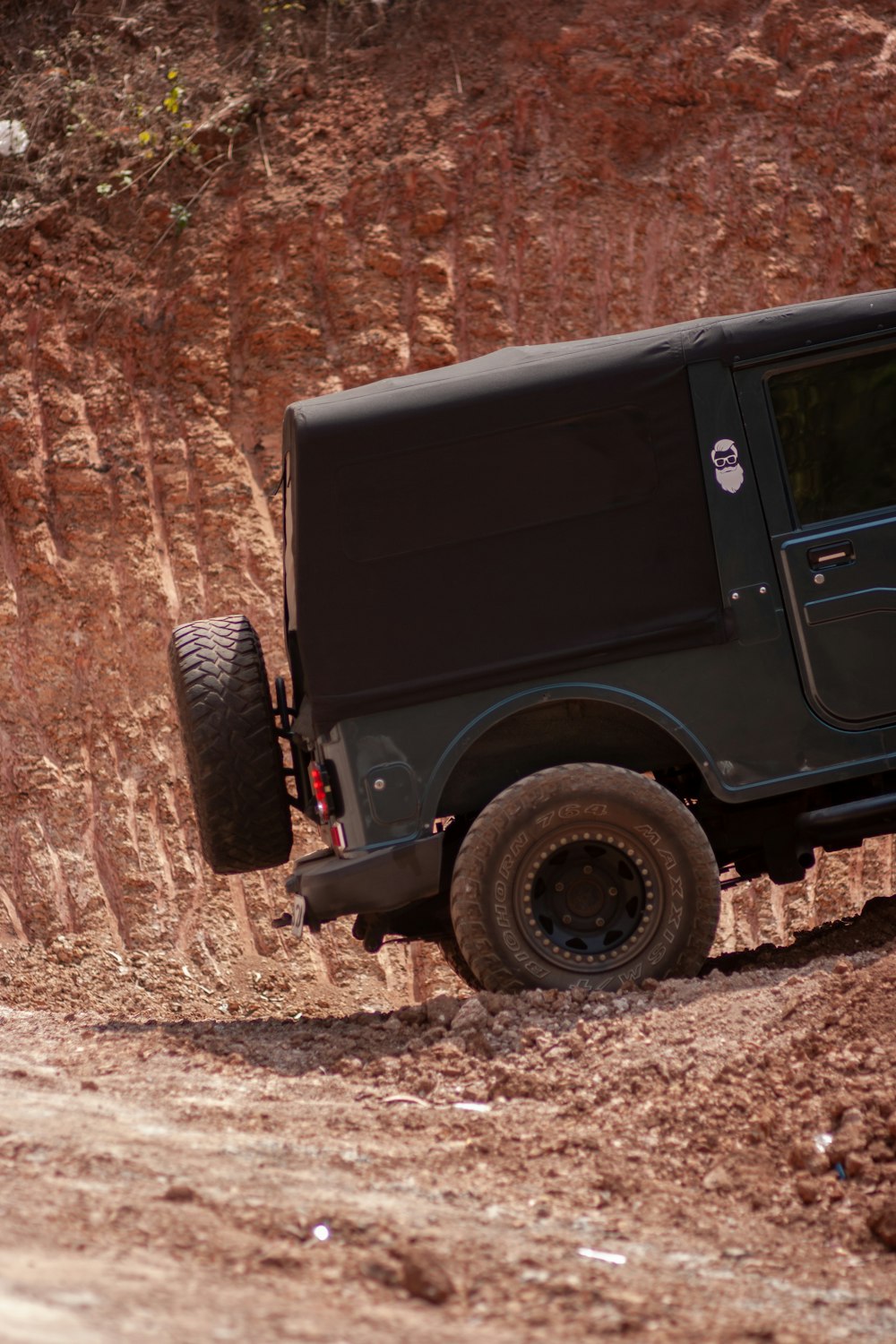 black jeep wrangler on brown dirt road during daytime