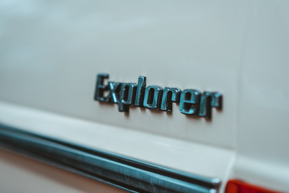 a close up of the word explorer on the back of a car