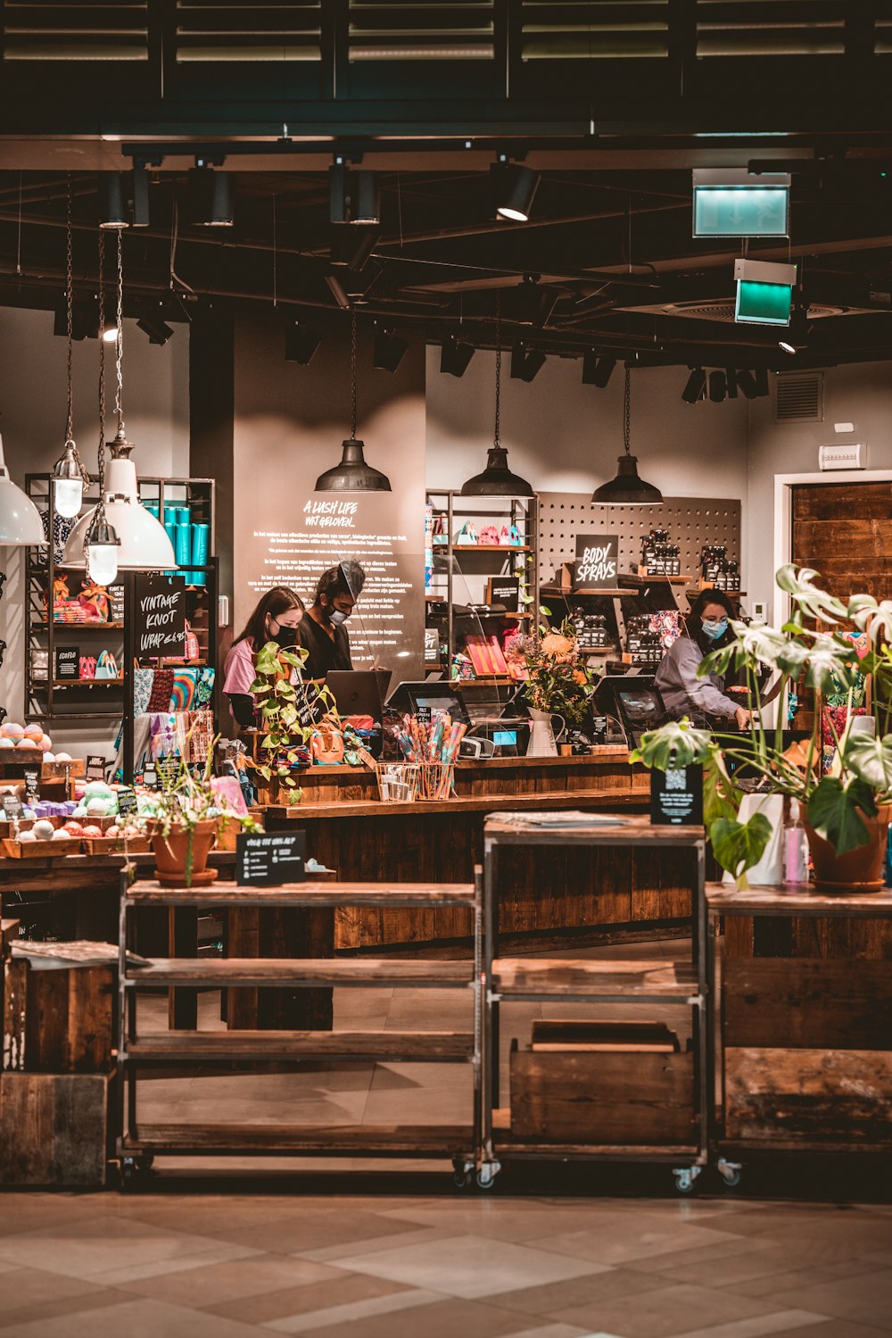 people standing in front of food counter