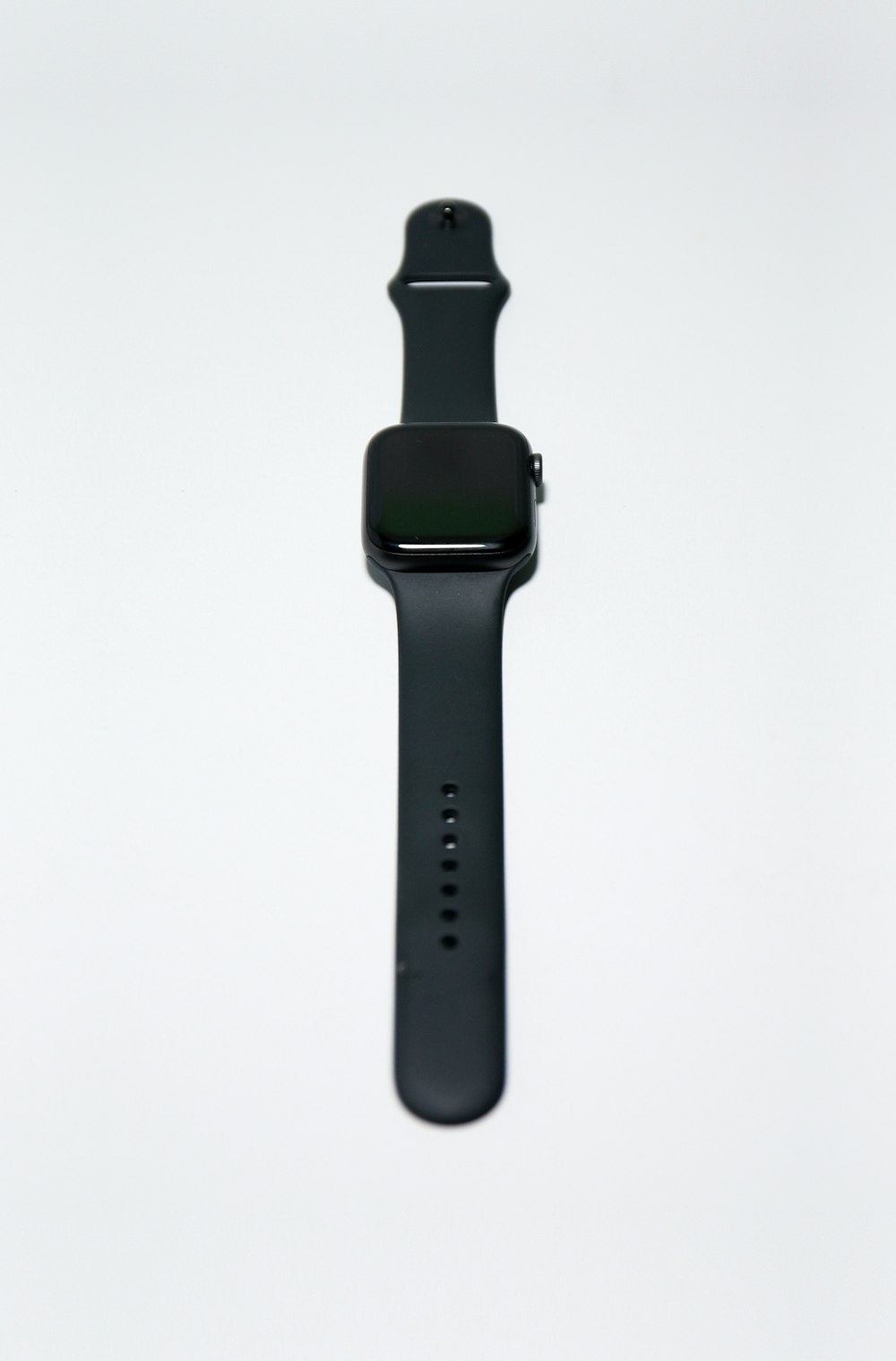 black apple watch with black sport band