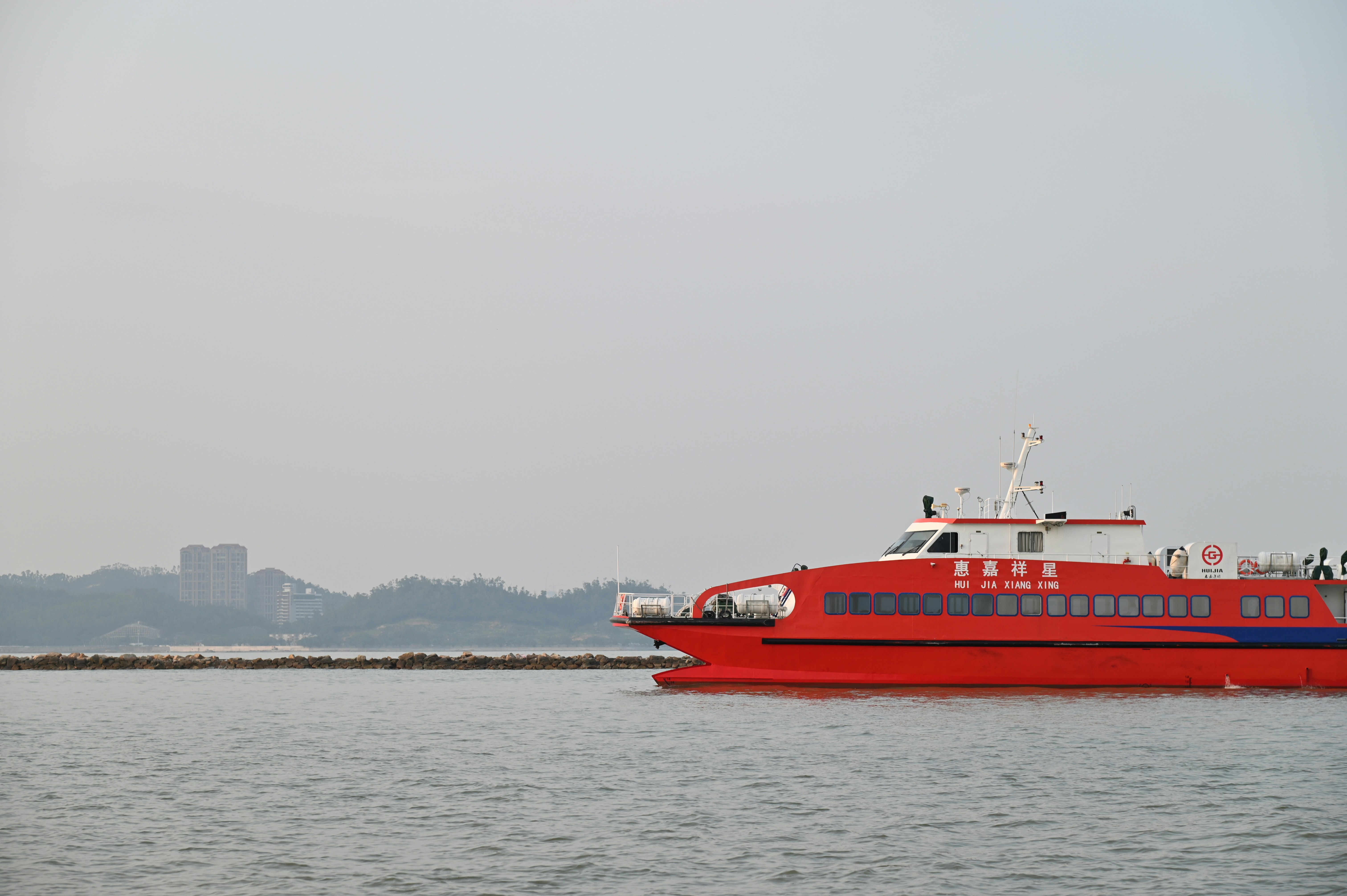 red and white boat on sea during daytime