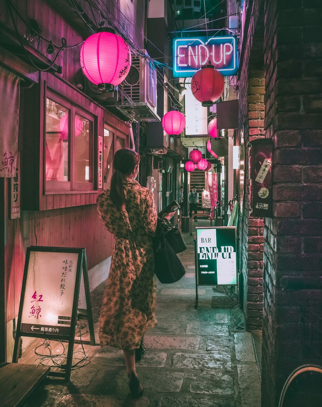 woman in brown and black leopard print coat standing beside store during night time