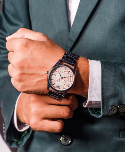 person wearing black chronograph watch