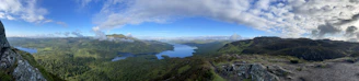 A panoramic view of Lake Victoria stretching beyond lush green savannas.