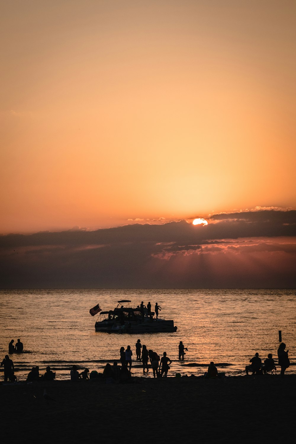 silhouette of people on beach during sunset