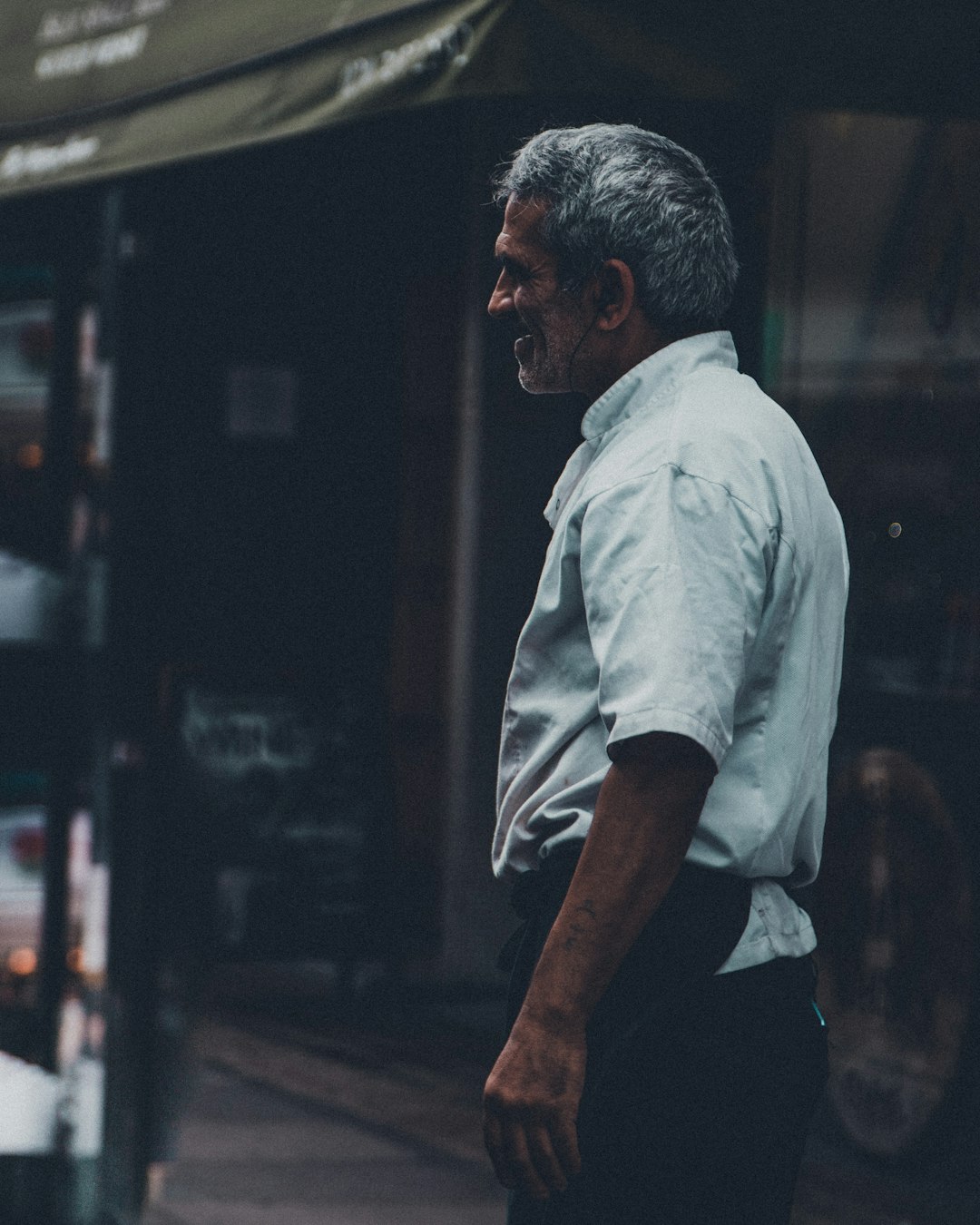 man in white t-shirt and black pants