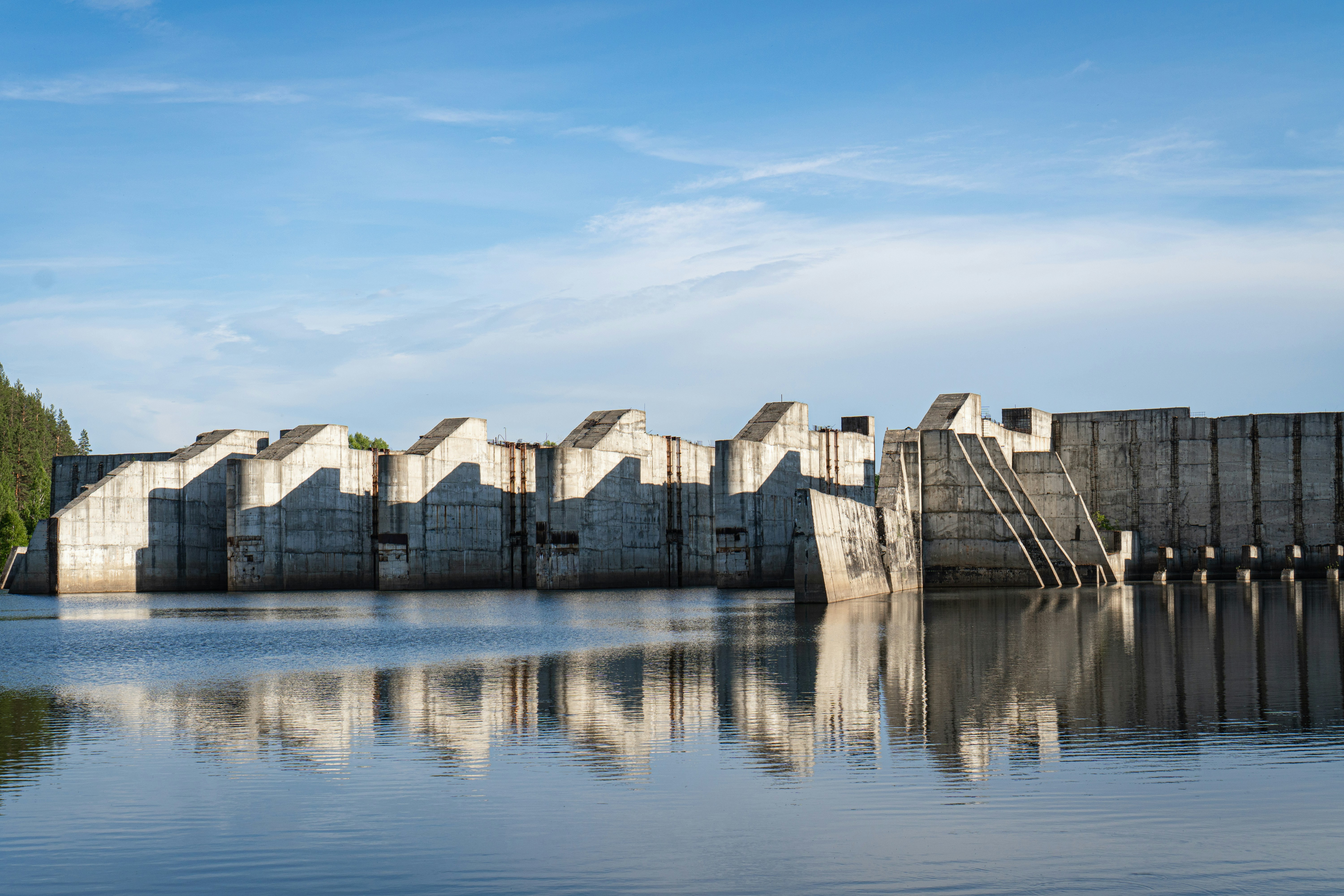 gray concrete building beside body of water during daytime