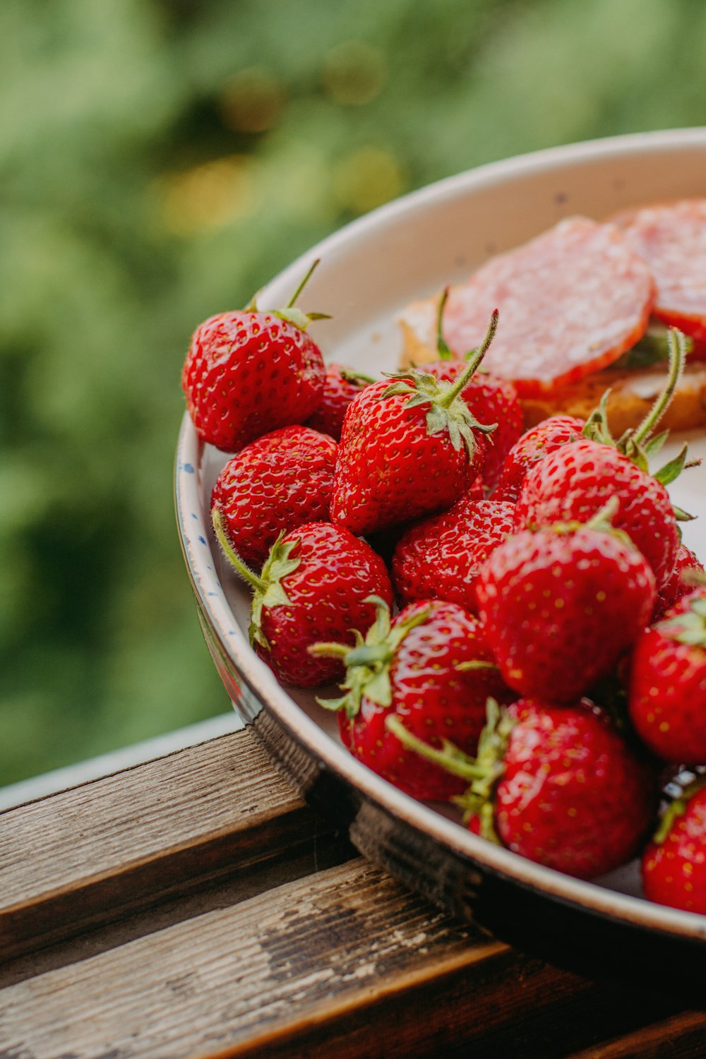 strawberries in white ceramic bowl