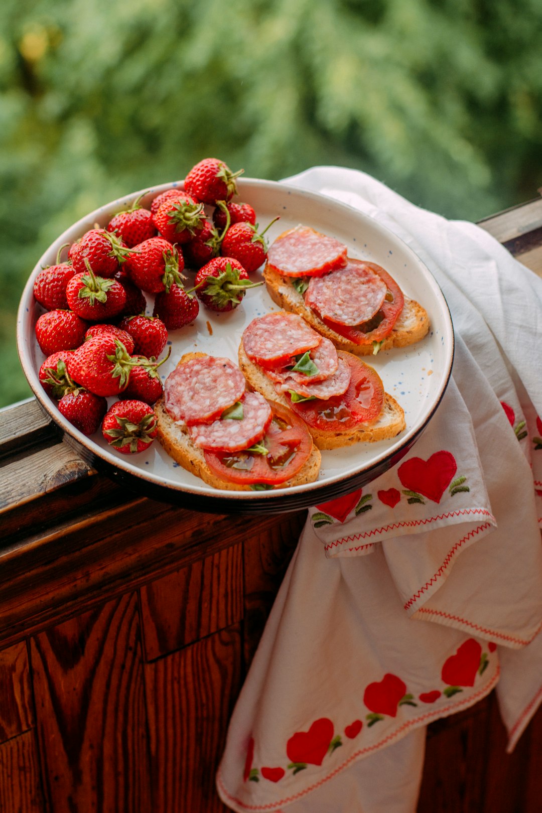 strawberry and blueberry on white ceramic plate