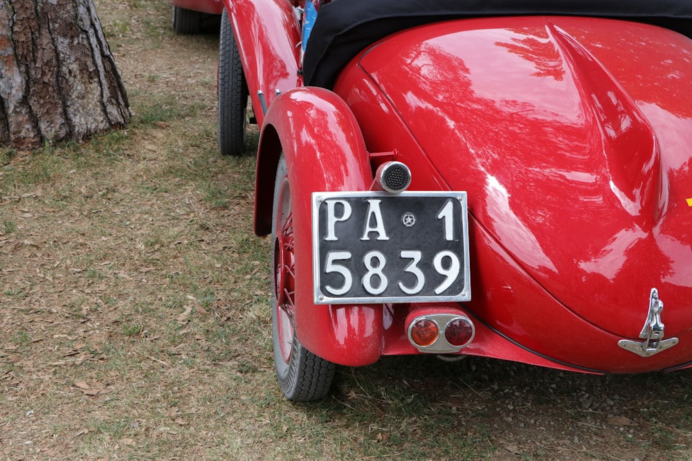 red car with white and black number 8