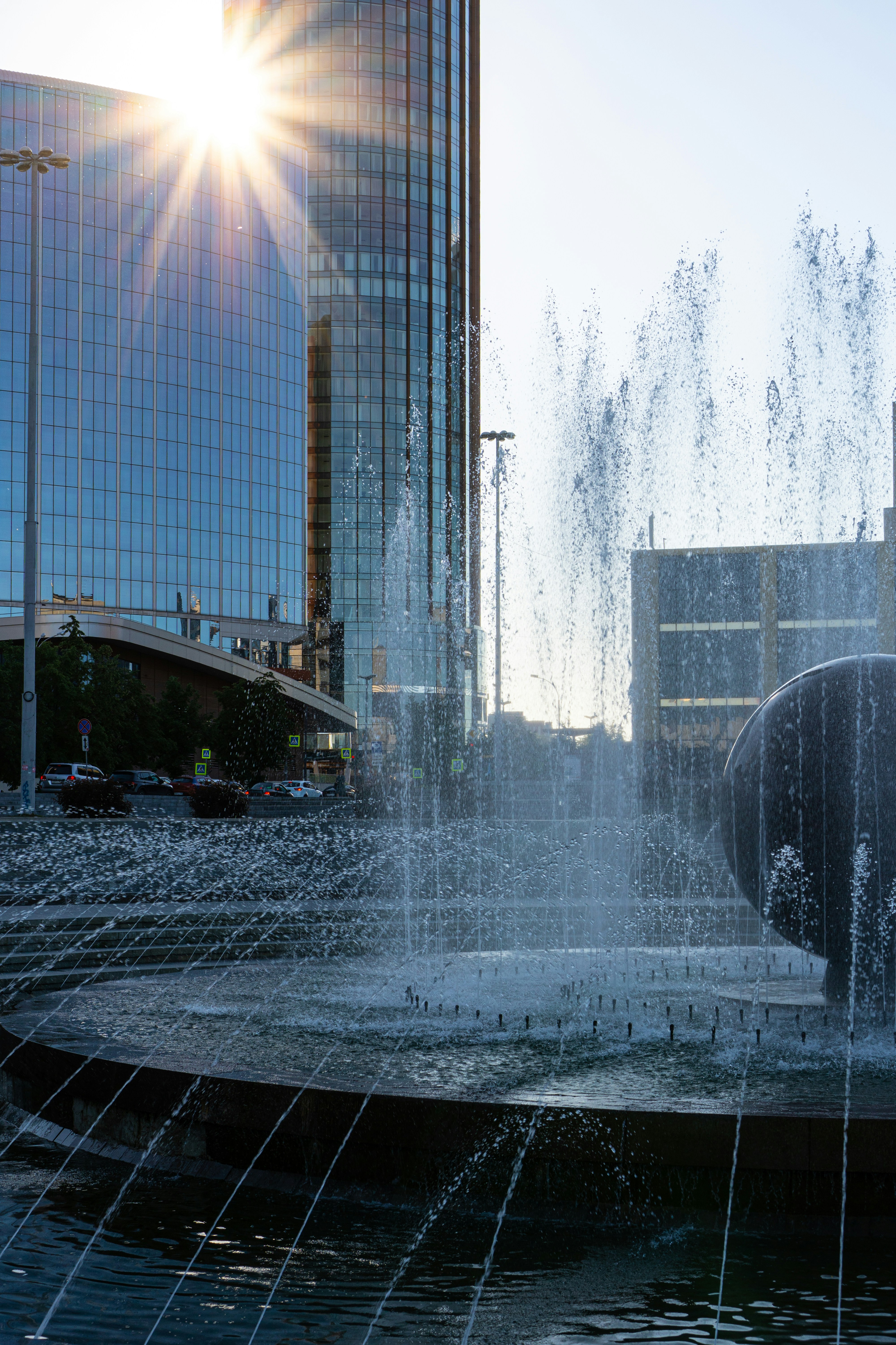 Water fountain near high rise building during daytime photo Free