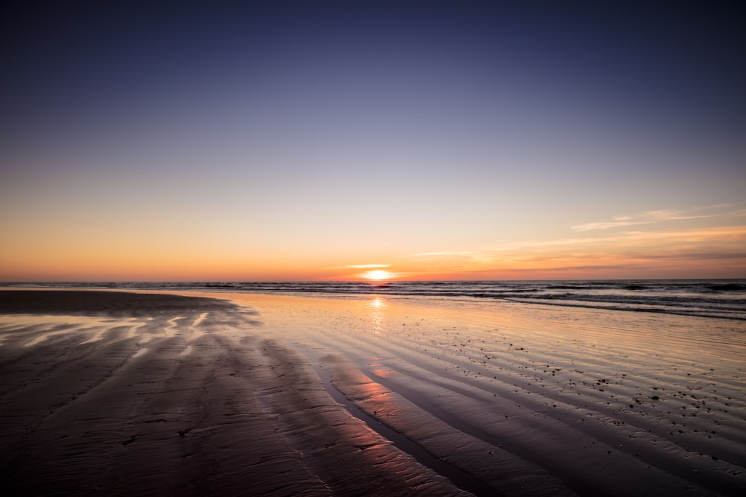 body of water during sunset