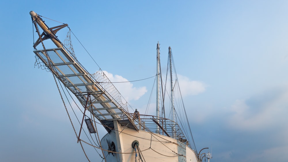 white and black boat on sea during daytime