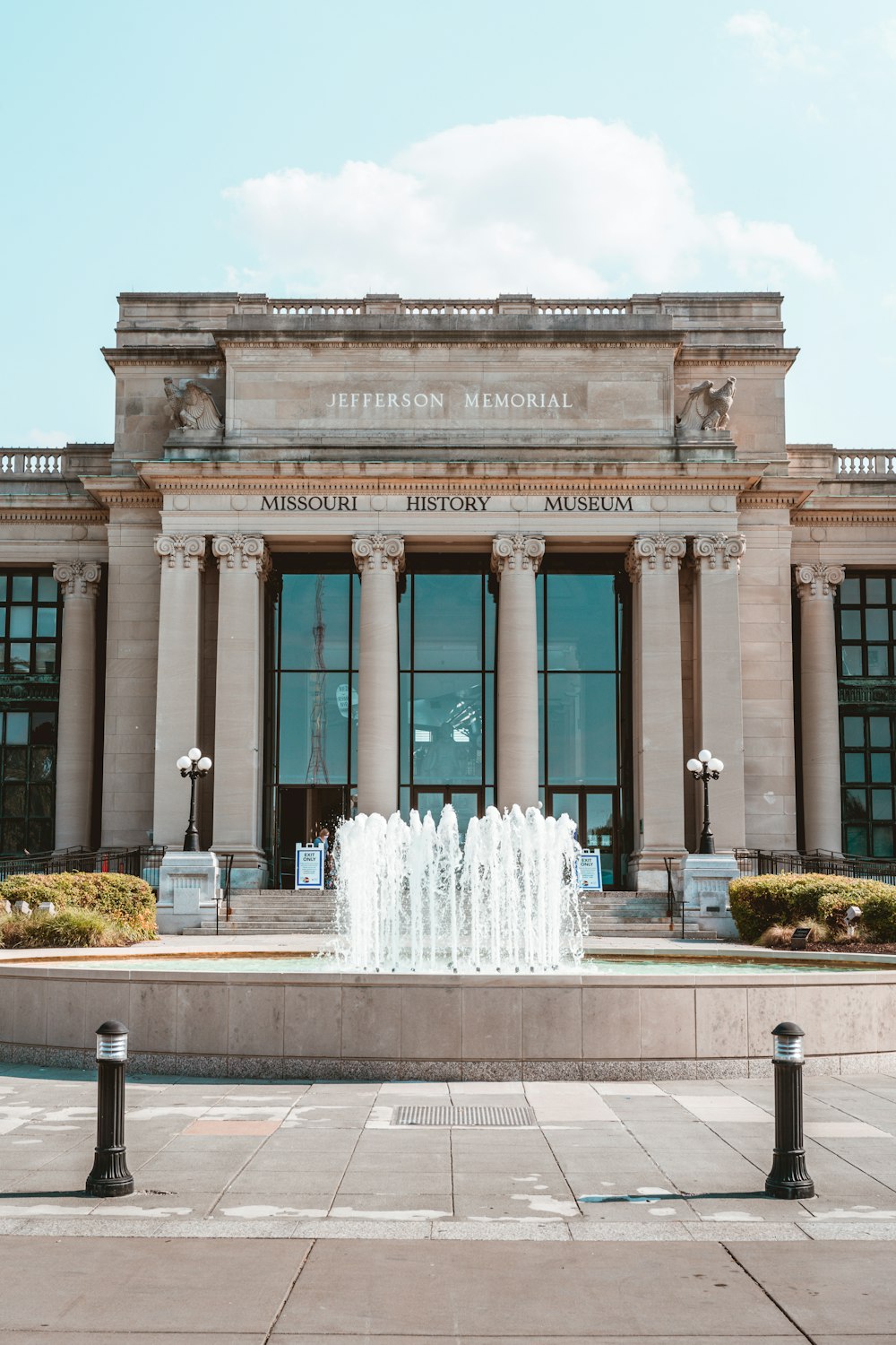 white concrete building with water fountain