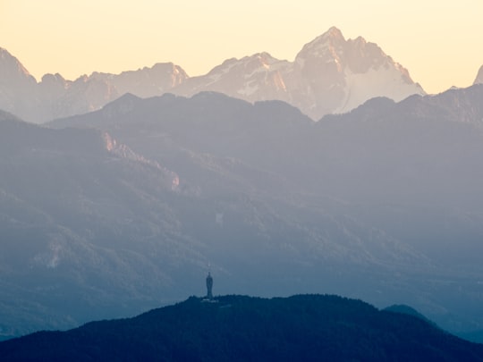 person standing on top of mountain during daytime in Carinthia Austria