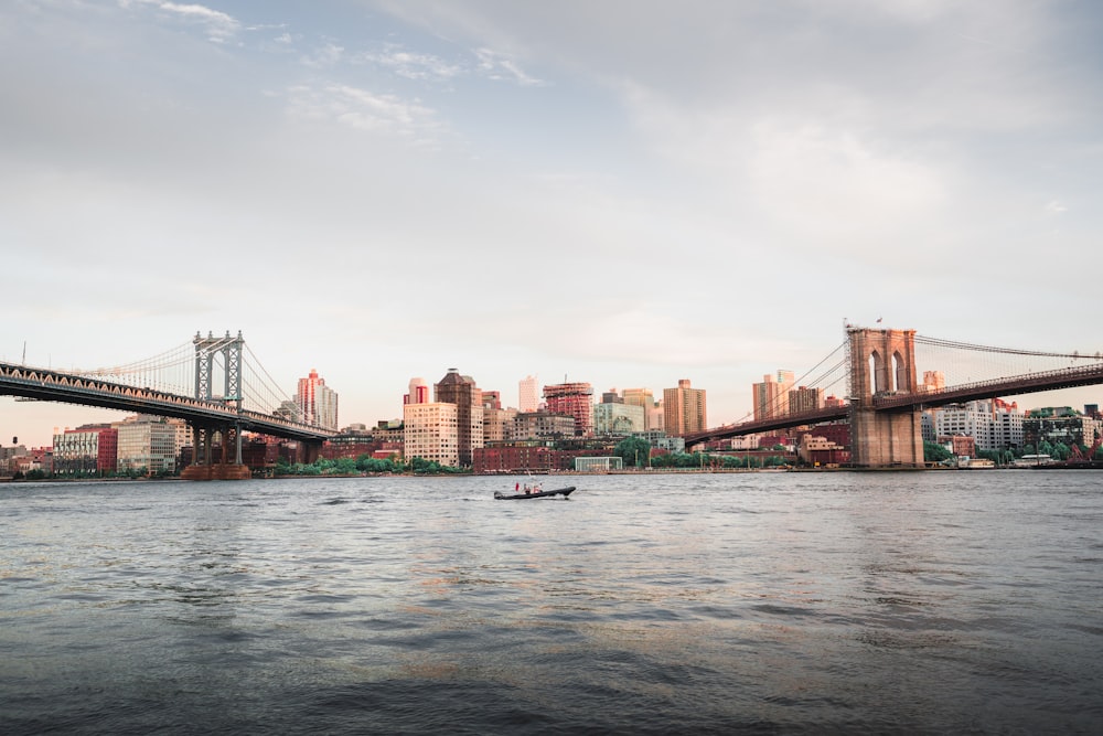 brown bridge over body of water during daytime