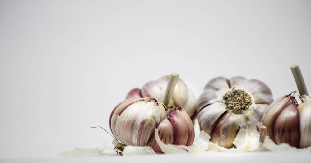 garlic and garlic on white surface