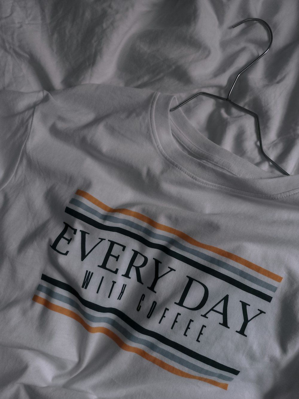 gray and orange crew neck shirt