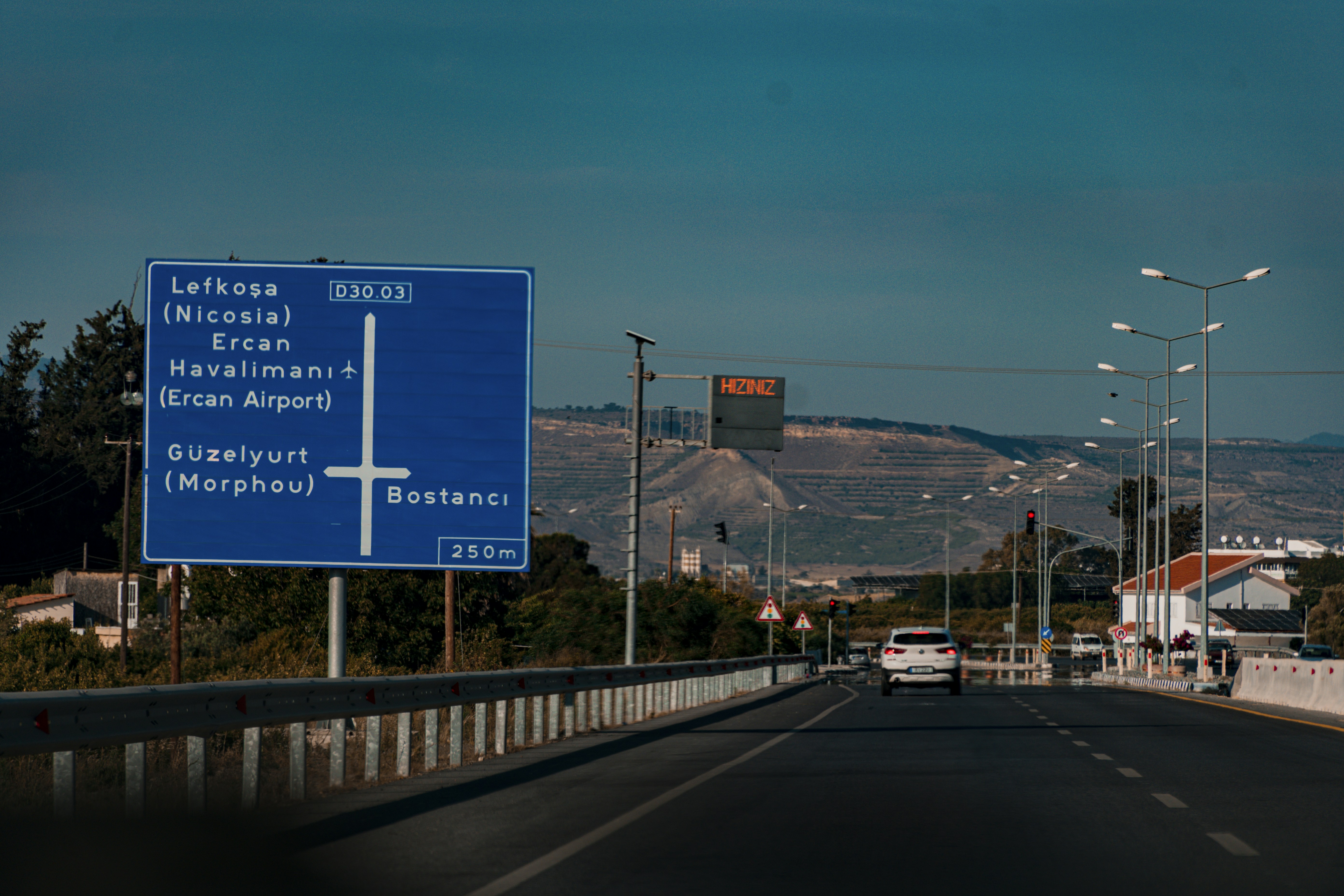 blue and white road sign