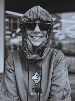 A laid-back model sporting trendy hoodies with witty slogans.