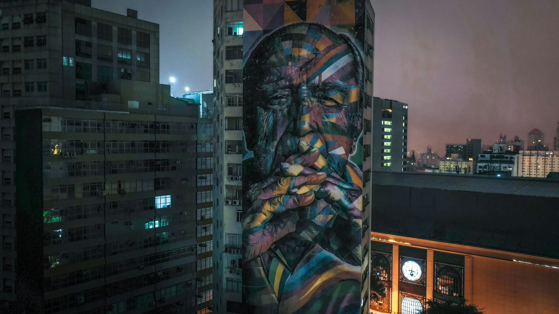a mural of a man's face on the side of a building