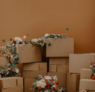 white and red flowers on brown cardboard boxes