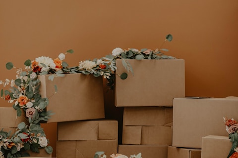 white and red flowers on brown cardboard boxes