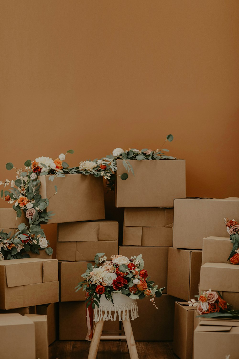 white and red flowers on brown cardboard boxes