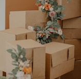 brown cardboard box with green and red flowers