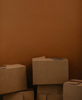 white cardboard box on brown wooden table