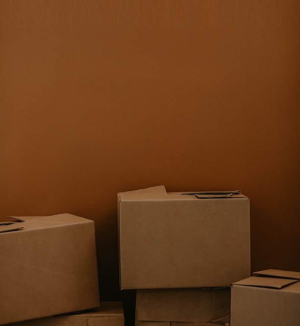 white cardboard box on brown wooden table