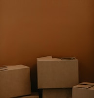 white cardboard box on brown wooden table