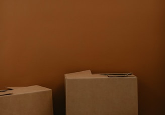 white cardboard box on brown wooden table
