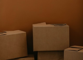 white cardboard box on brown wooden table