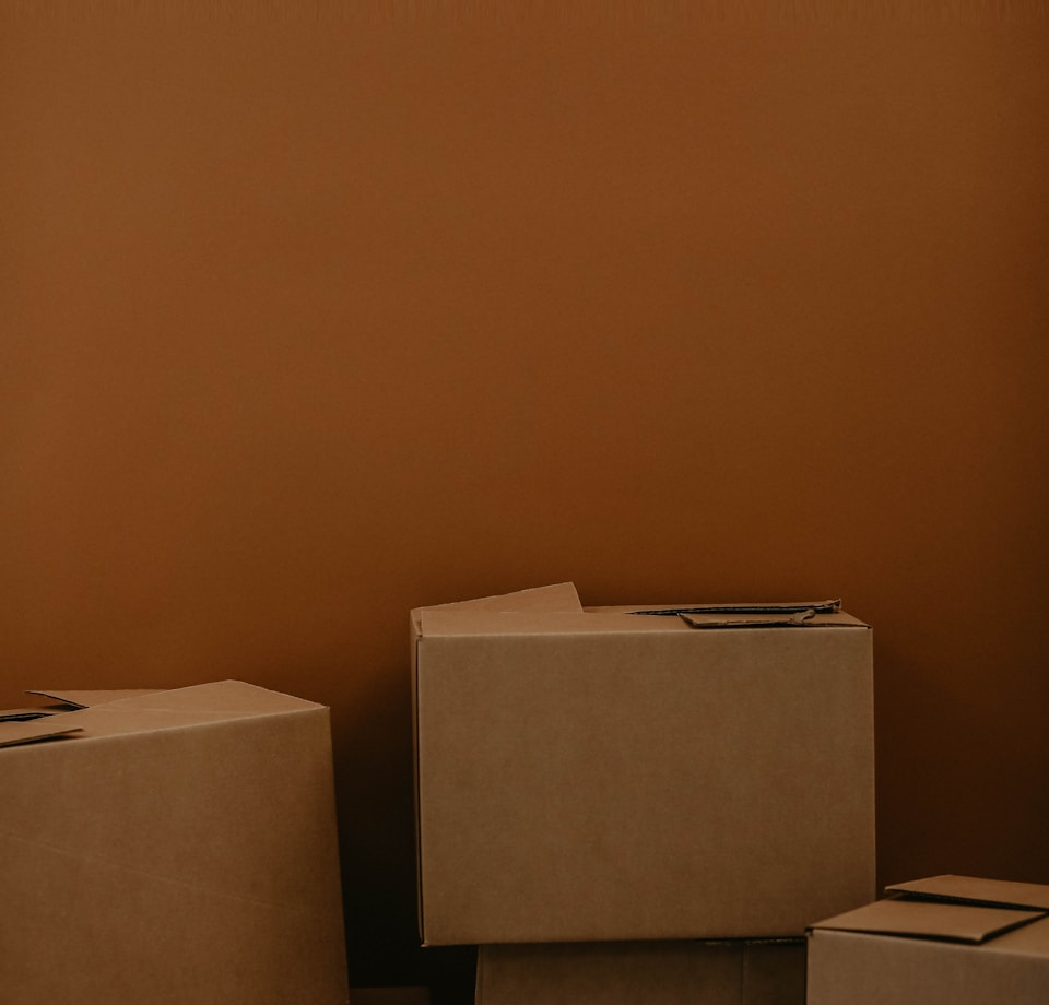 white cardboard box on brown wooden table