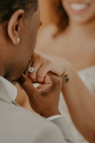 man in white shirt wearing silver ring