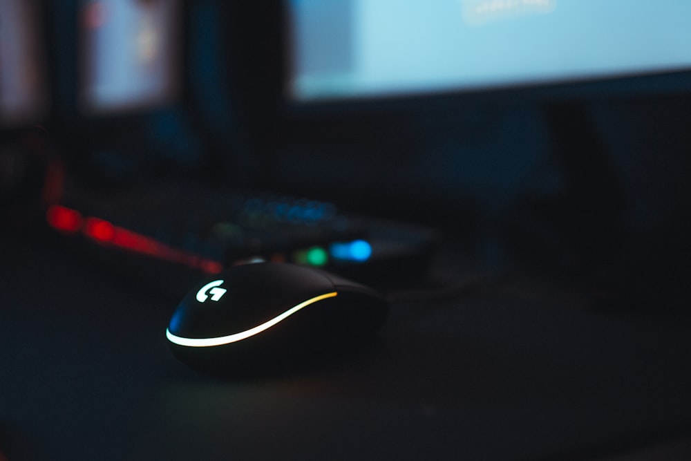 black and white logitech corded computer mouse