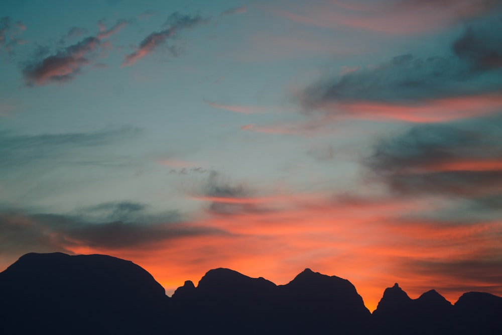 silhouette of mountains during sunset