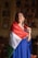 woman in blue white and red long sleeve shirt holding white and red flag