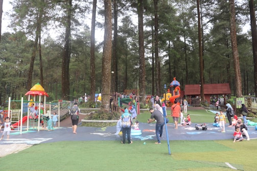Parents watching happily as their children enjoy the safe and colorful play area.