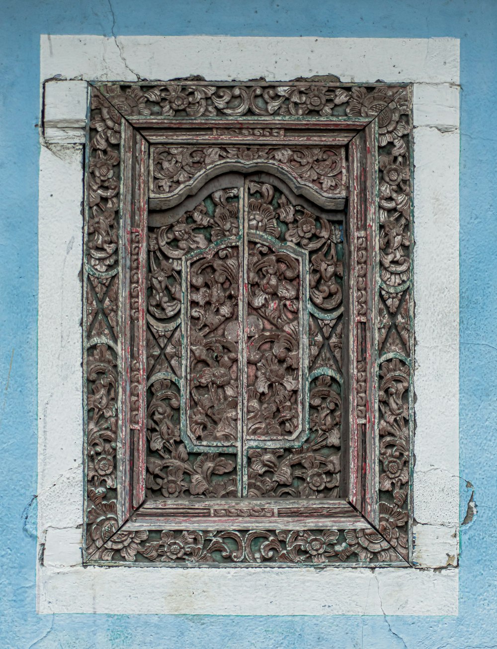 brown and green wooden door