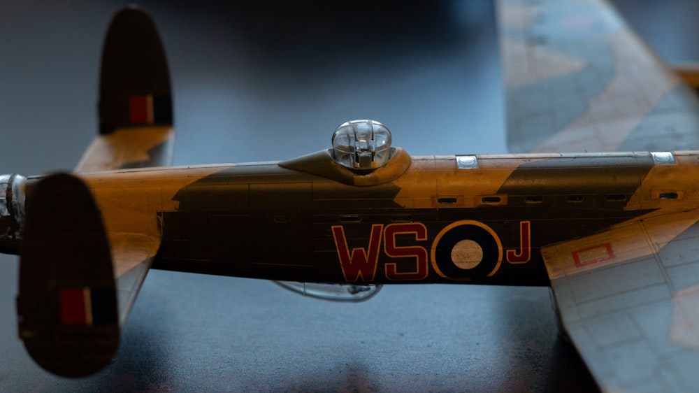 a close up of a toy airplane on a table