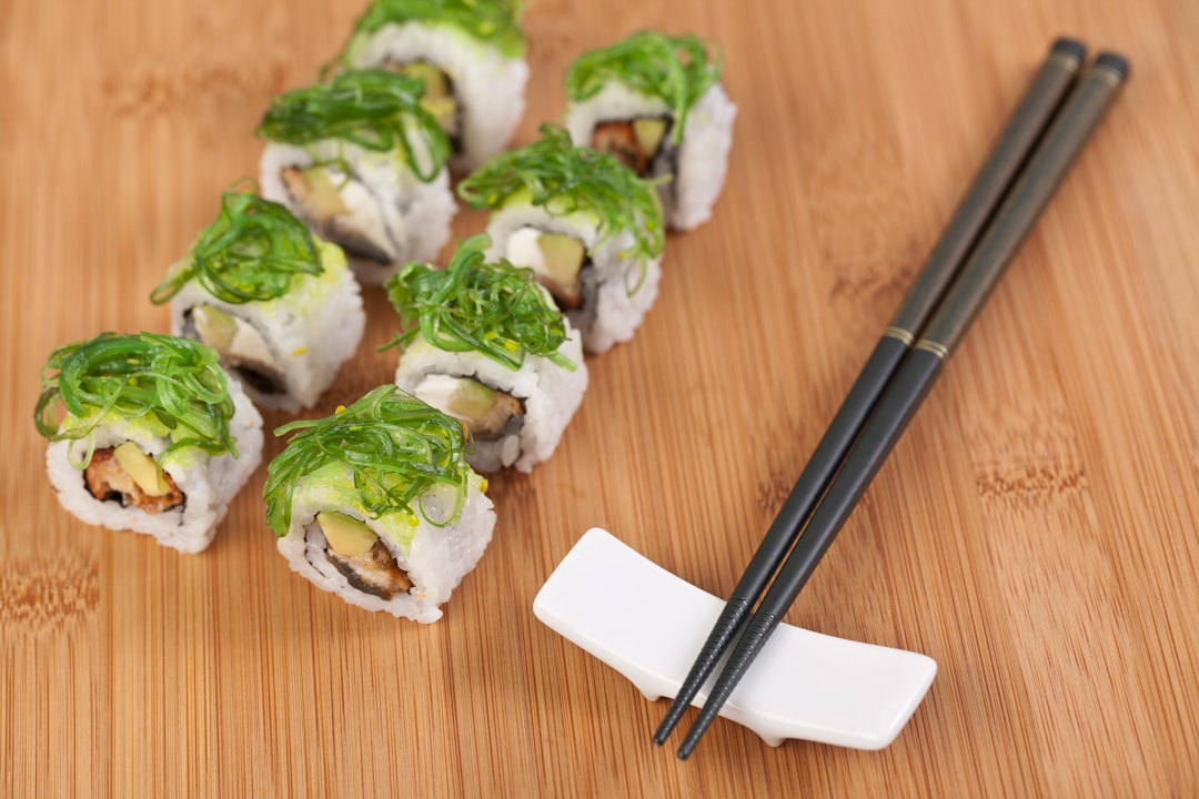 sushi roll on brown wooden table