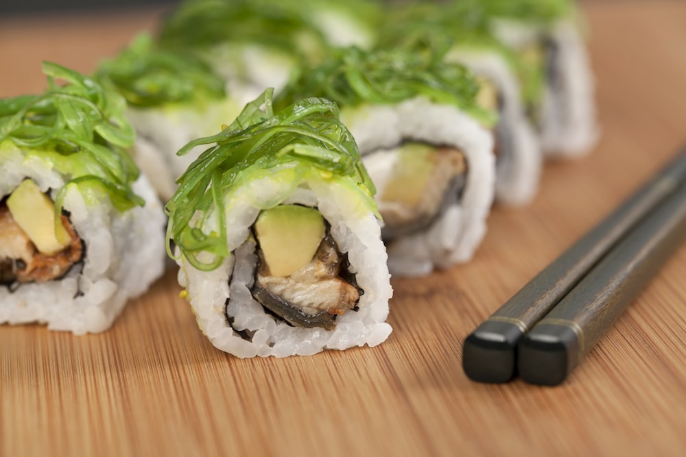 green and white vegetable on brown wooden table