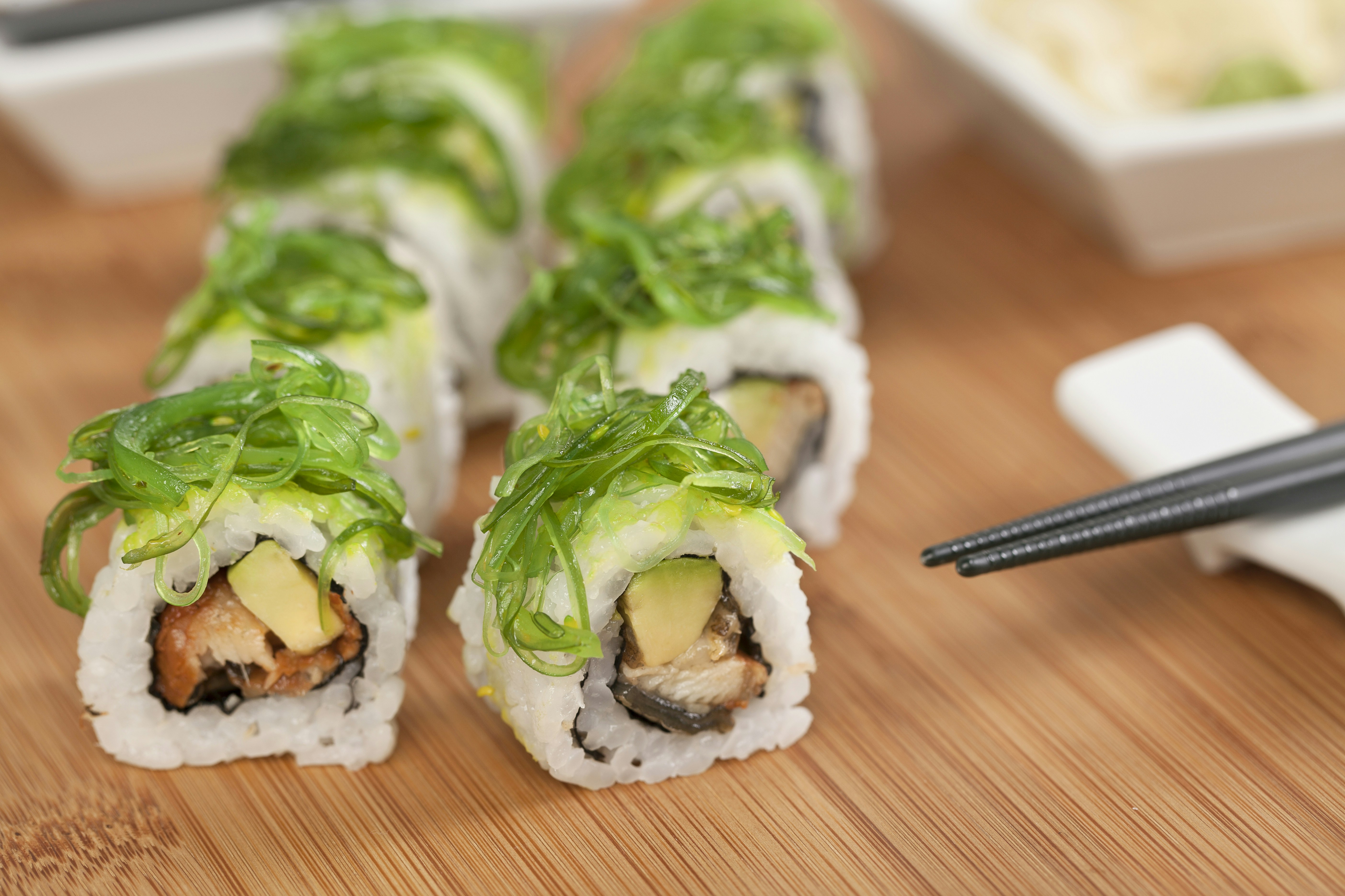 sushi on brown wooden table