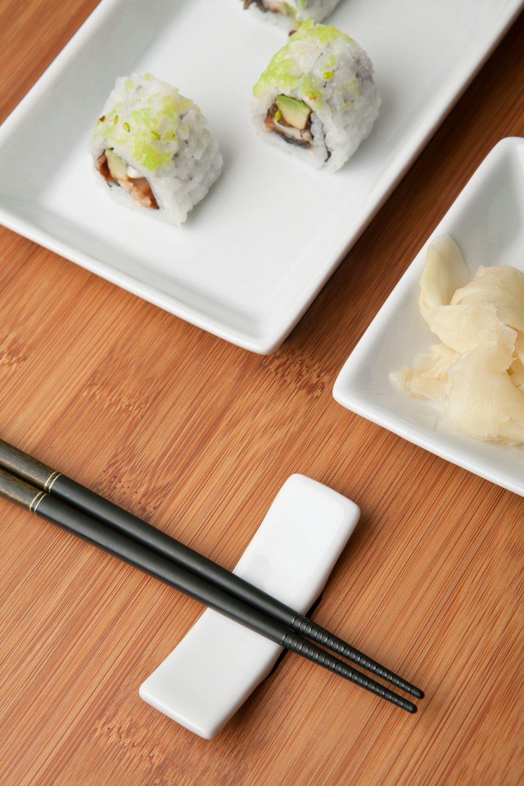 white ceramic plate with black chopsticks
